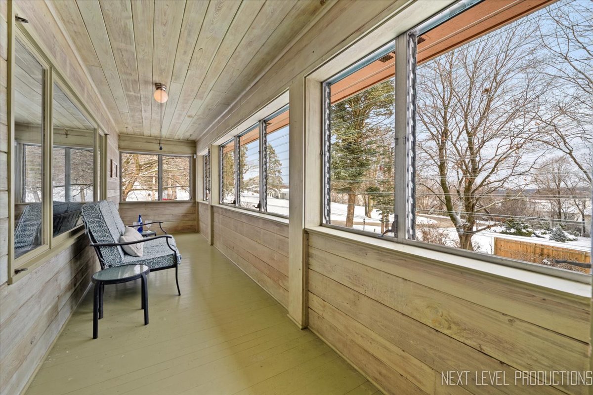 38W443 Sunset Drive St. Charles, IL 60175 - Photo 13 of 33 a view of a room with a large window and chair