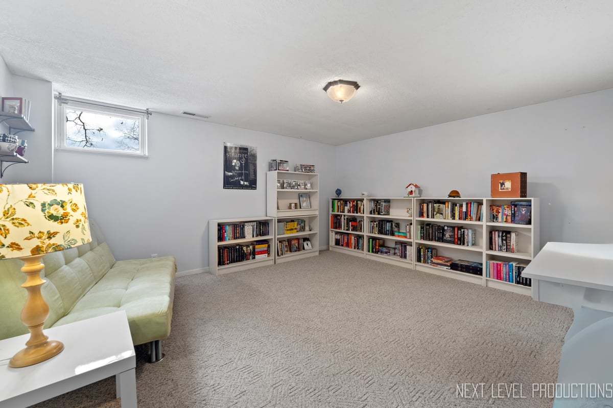 38W443 Sunset Drive St. Charles, IL 60175 - Photo 27 of 33 a view of a livingroom with furniture and cabinet