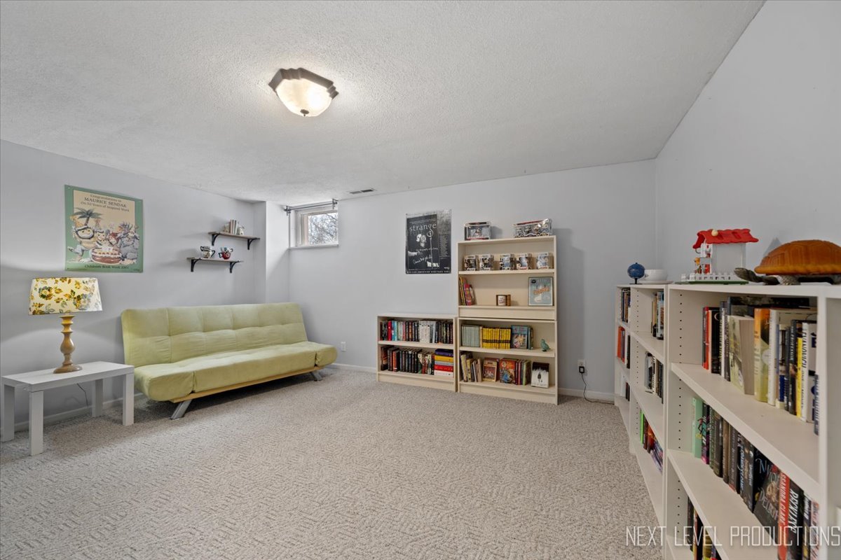 38W443 Sunset Drive St. Charles, IL 60175 - Photo 28 of 33 a bedroom with furniture and baby