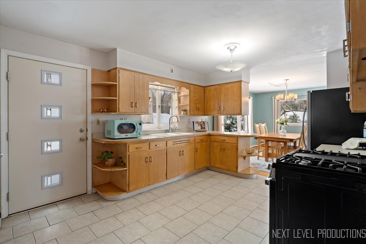 38W443 Sunset Drive St. Charles, IL 60175 - Photo 4 of 33 a kitchen with a sink appliances and cabinets