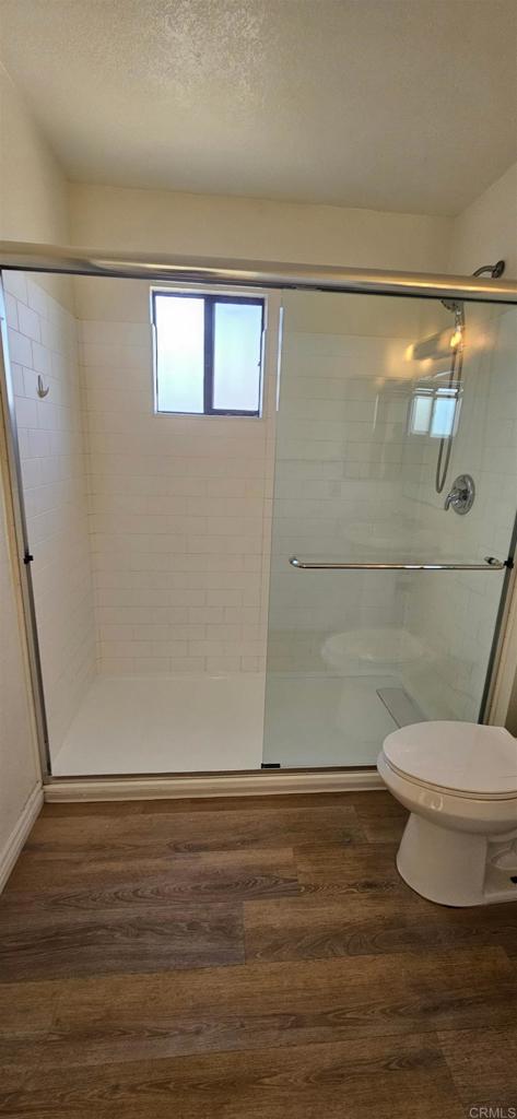658-660 Santa Fe Drive Encinitas, CA 92024 - Photo 14 of 14 a bathroom with a toilet and a shower