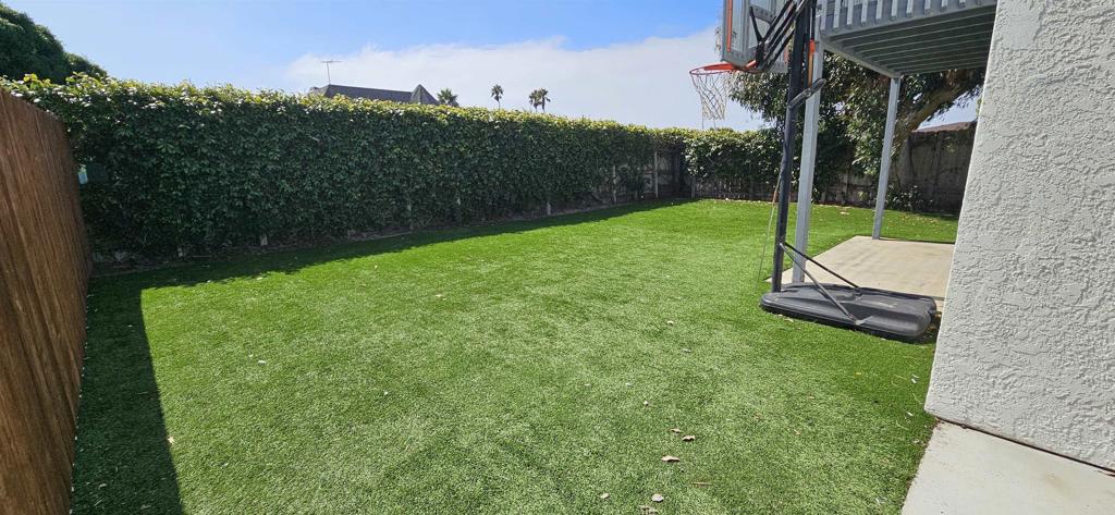 658-660 Santa Fe Drive Encinitas, CA 92024 - Photo 9 of 14 a backyard of a house with lots of green space