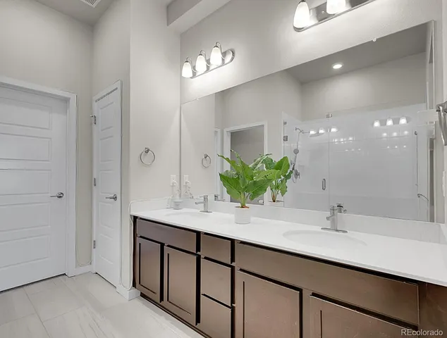 a bathroom with sink and mirror