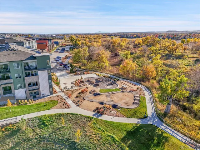 an aerial view of residential building and ocean view