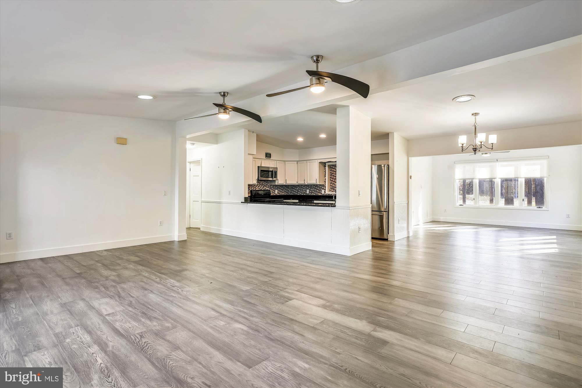25545 Chance Farm Road St. Michaels, MD 21663 - Photo 11 of 47 Living room overlooking kitchen and dining room