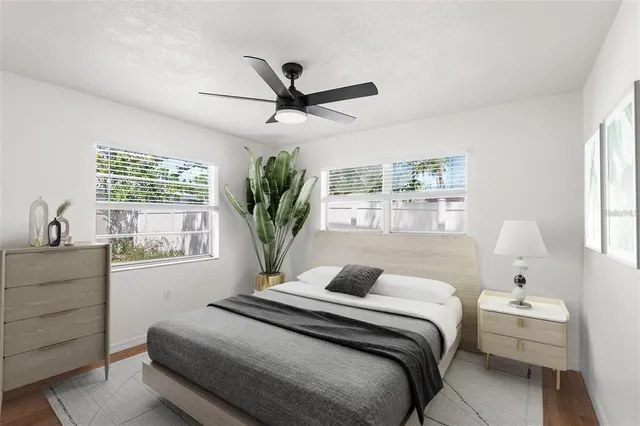 a bedroom with a large bed and a window