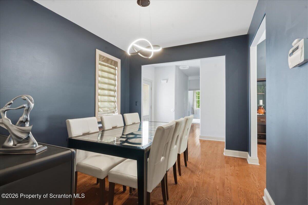 99 Hilltop Road Waverly, PA 18471 - Photo 11 of 41 a view of a dining room with furniture and wooden floor