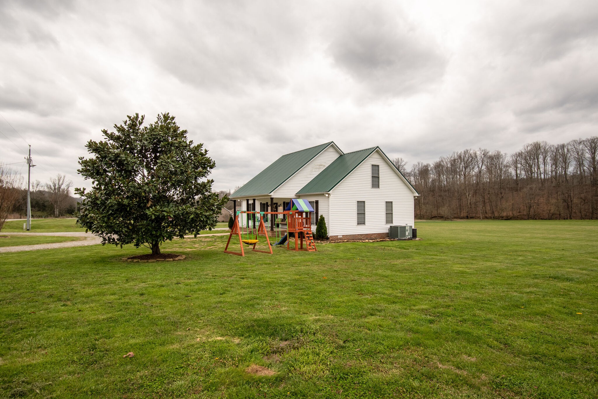 7593 Beech Hill Road Pulaski, TN 38478 - Photo 2 of 40 a big house with a big yard and large trees