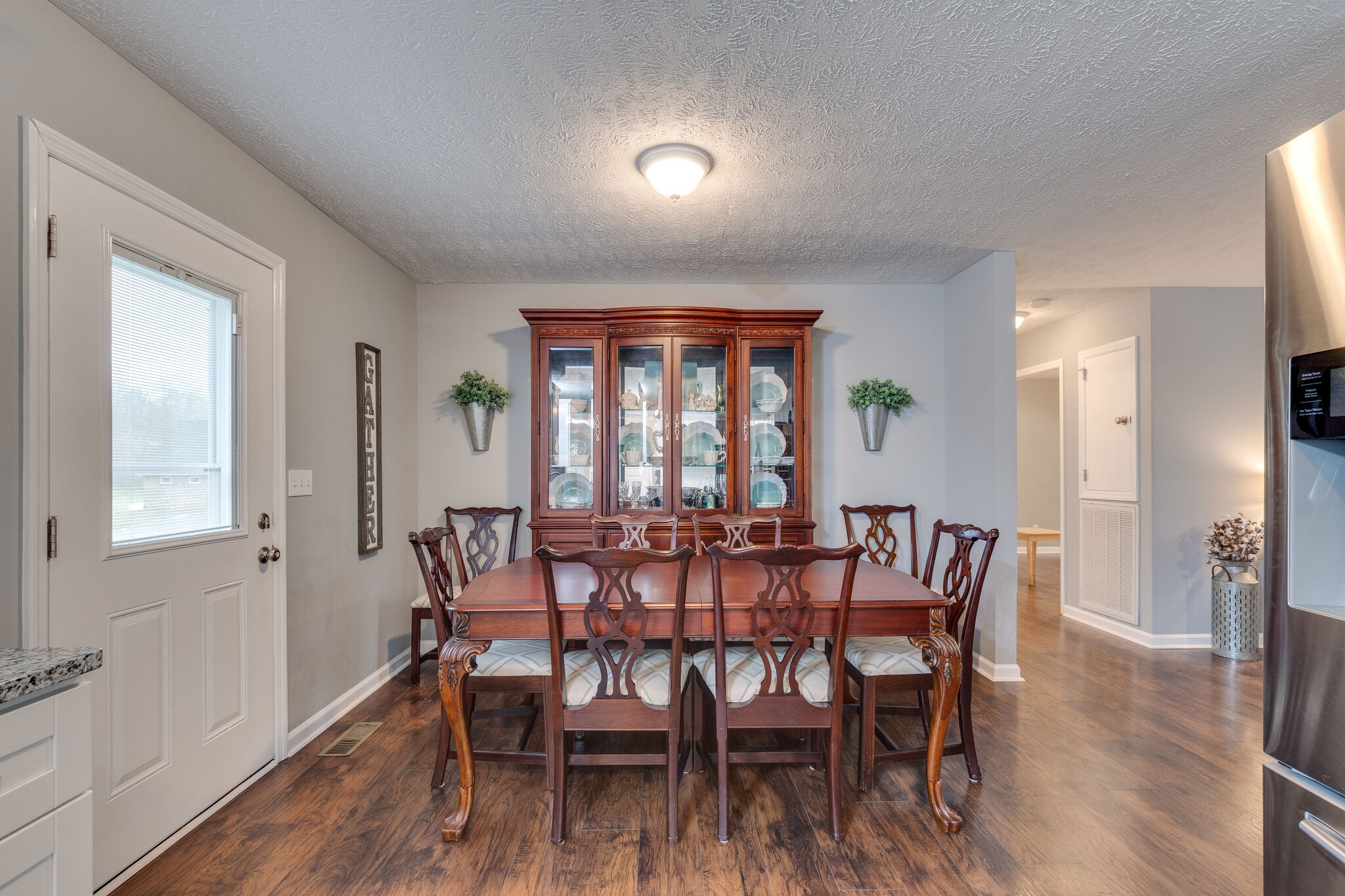 7593 Beech Hill Road Pulaski, TN 38478 - Photo 13 of 40 a view of a dining room with furniture window and wooden floor