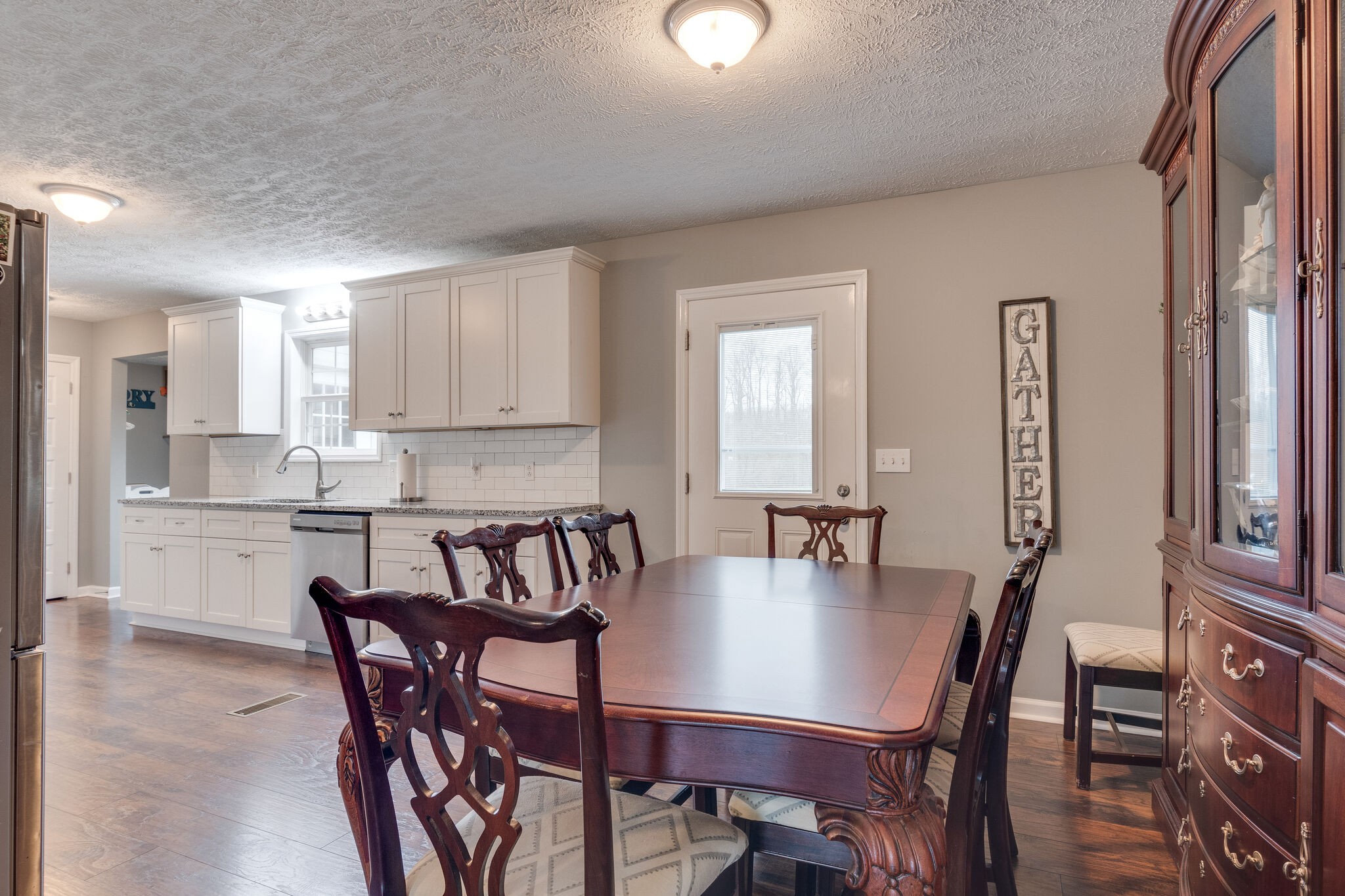 7593 Beech Hill Road Pulaski, TN 38478 - Photo 14 of 40 a view of a dining room with furniture and wooden floor