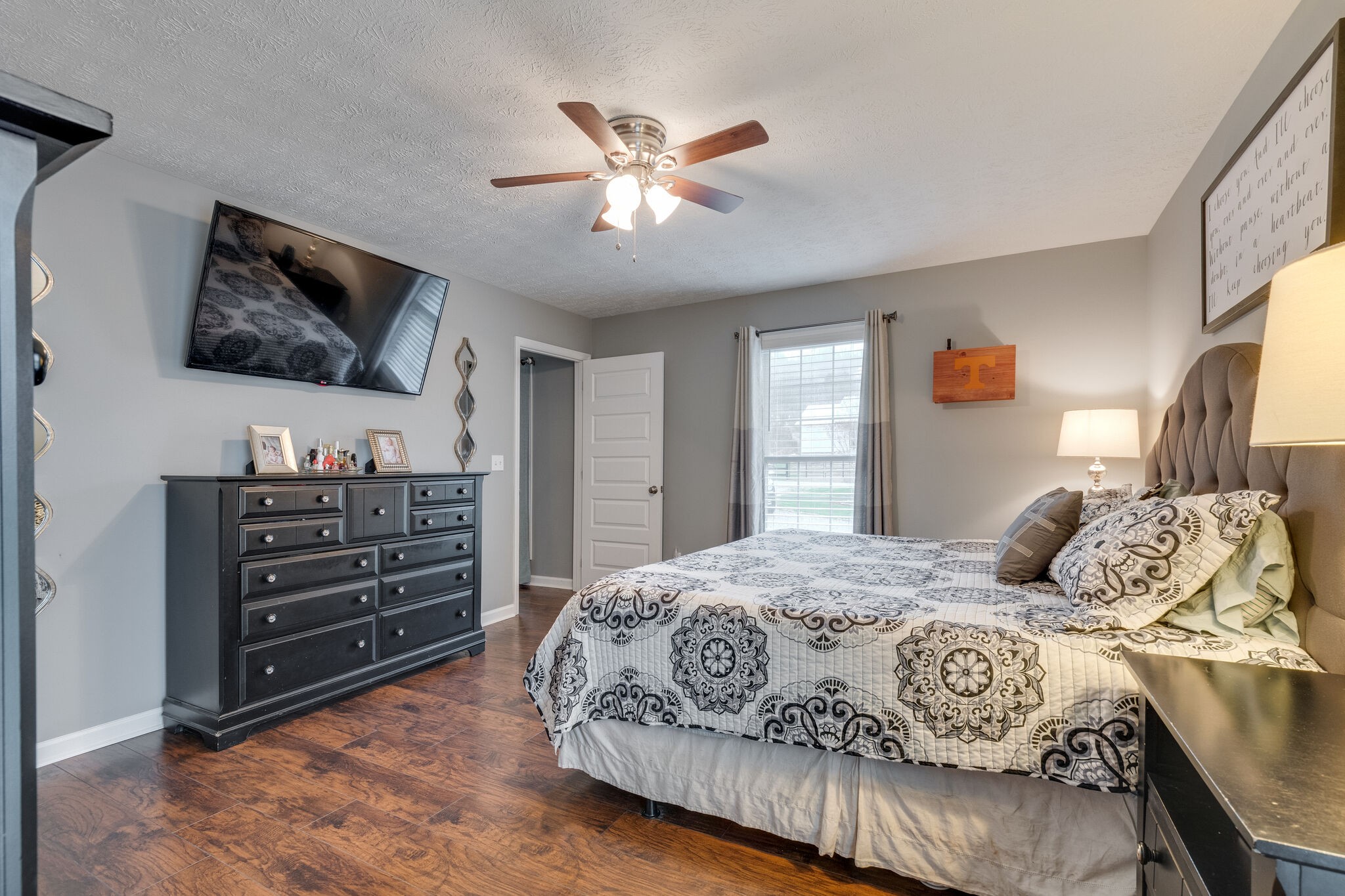 7593 Beech Hill Road Pulaski, TN 38478 - Photo 19 of 40 a bedroom with a bed and a flat screen tv