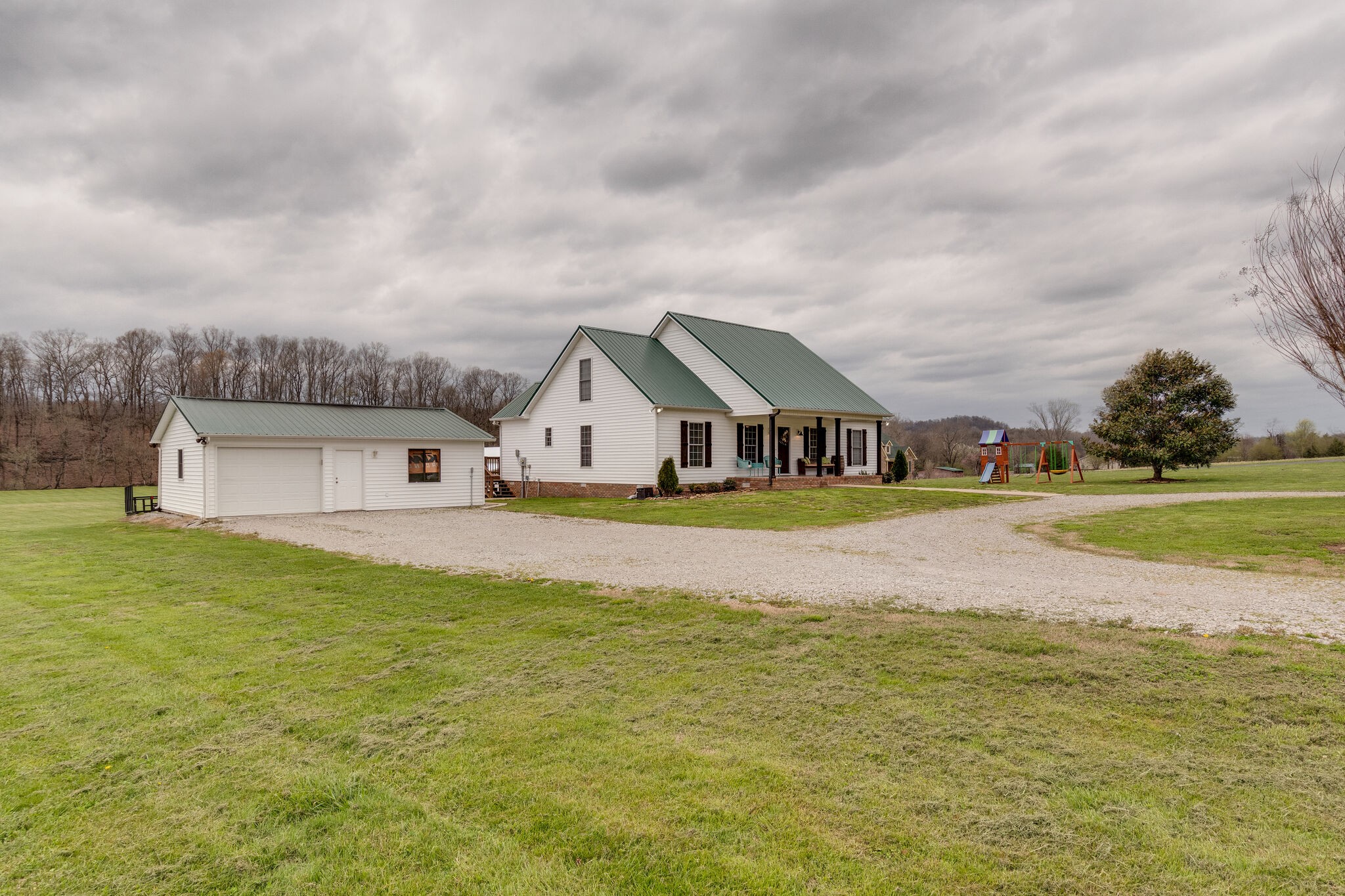 7593 Beech Hill Road Pulaski, TN 38478 - Photo 3 of 40 a view of houses with outdoor space and lakeside