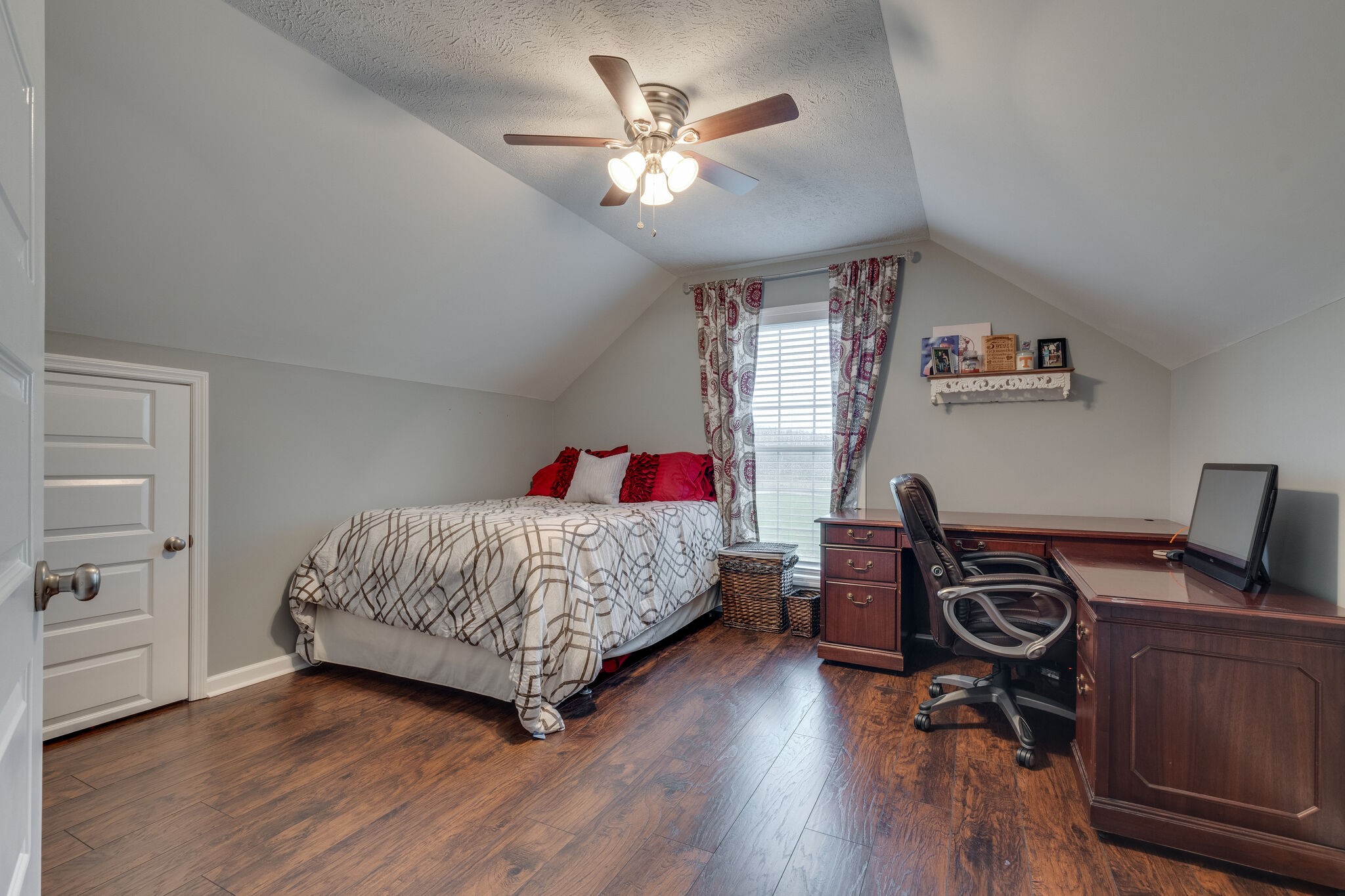 7593 Beech Hill Road Pulaski, TN 38478 - Photo 26 of 40 a bedroom with a bed and a chandelier