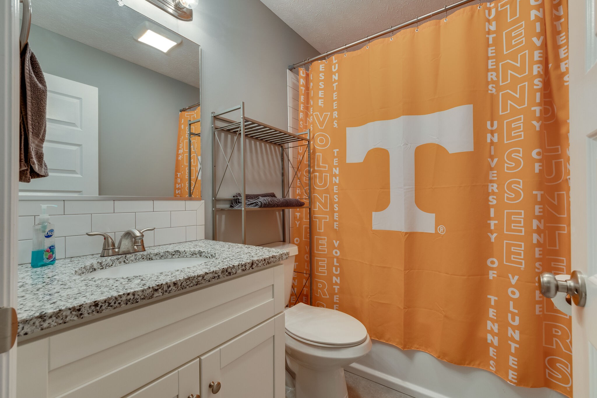 7593 Beech Hill Road Pulaski, TN 38478 - Photo 27 of 40 a bathroom with a granite countertop sink toilet and shower
