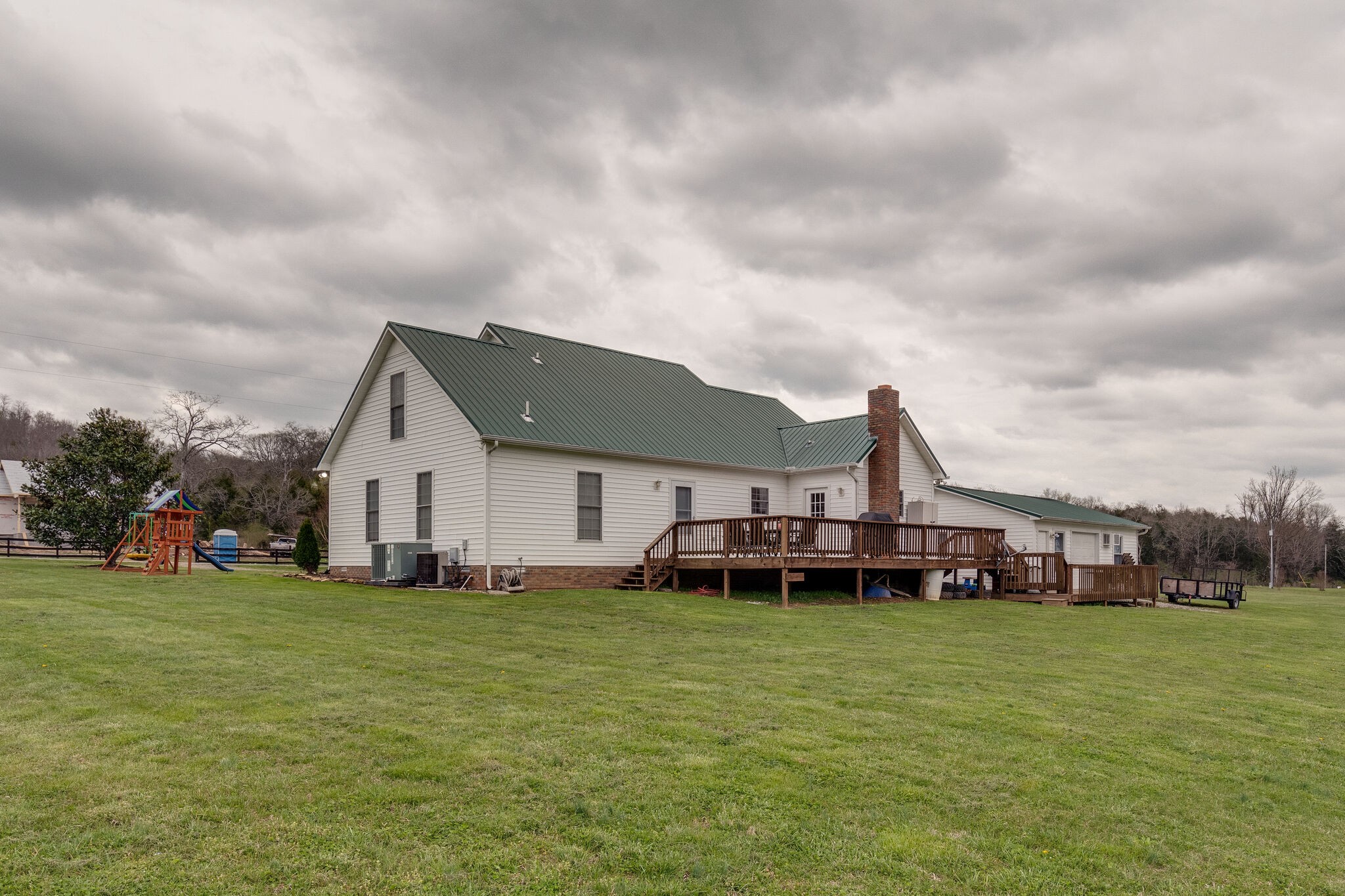 7593 Beech Hill Road Pulaski, TN 38478 - Photo 30 of 40 a view of a house with a big yard and sitting area