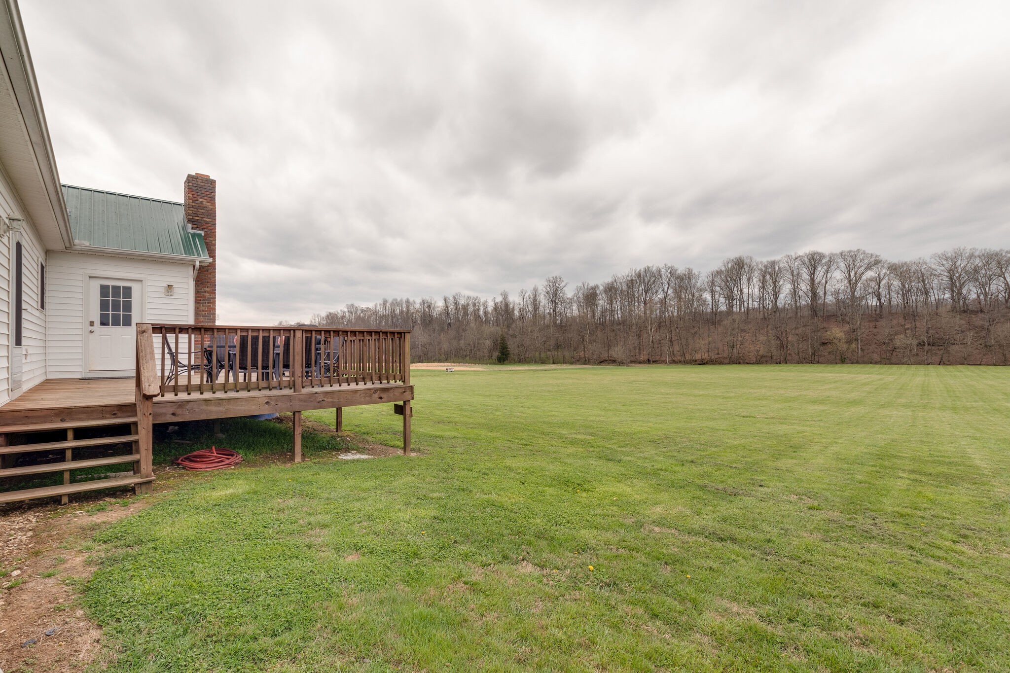 7593 Beech Hill Road Pulaski, TN 38478 - Photo 32 of 40 a view of a house with backyard and a lake view
