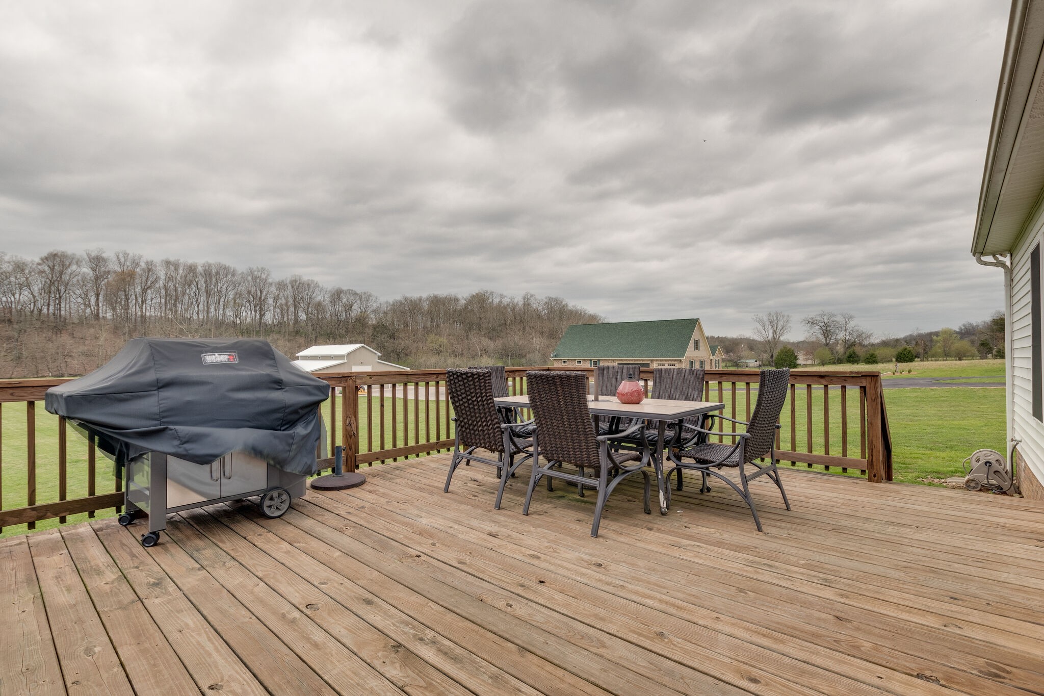 7593 Beech Hill Road Pulaski, TN 38478 - Photo 34 of 40 a view of a terrace with wooden floor table and chairs