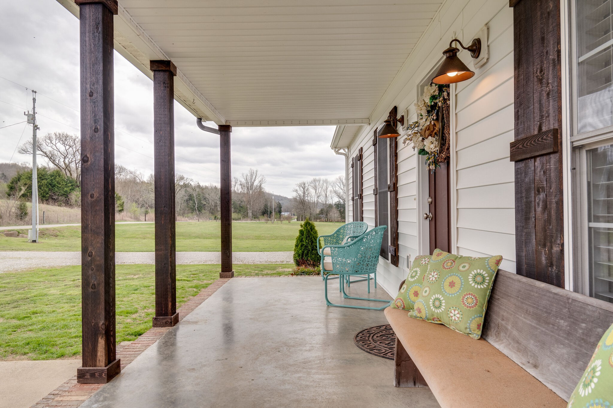 7593 Beech Hill Road Pulaski, TN 38478 - Photo 8 of 40 a view of a living room with furniture and floor to ceiling window