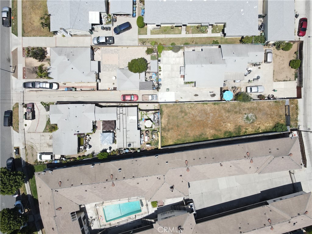 802 North Market Street Inglewood, CA 90302 - Photo 15 of 16 an aerial view of a kitchen with stainless steel appliances kitchen island granite countertop a sink and white cabinets