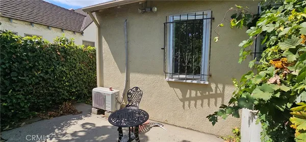 a view of an outdoor space with a chair and the potted plant