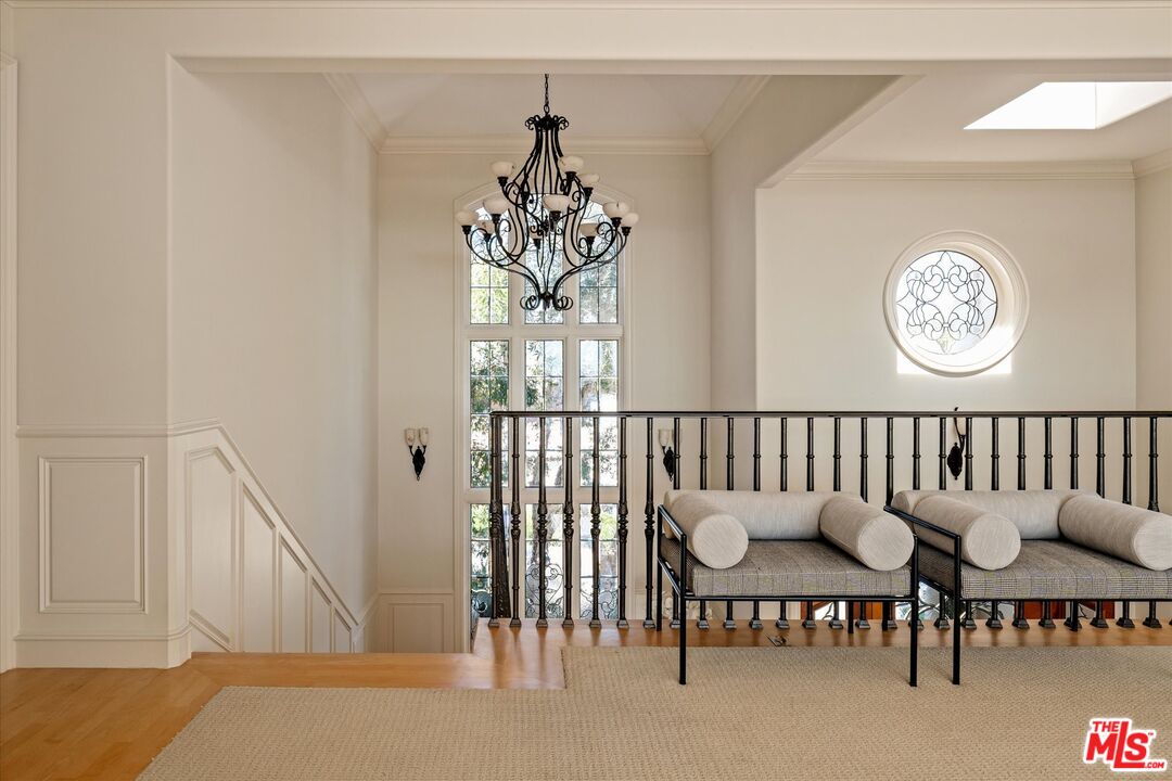 10814 Savona Road Los Angeles, CA 90077 - Photo 14 of 37 a view of a hallway to dining room and livingroom with furniture