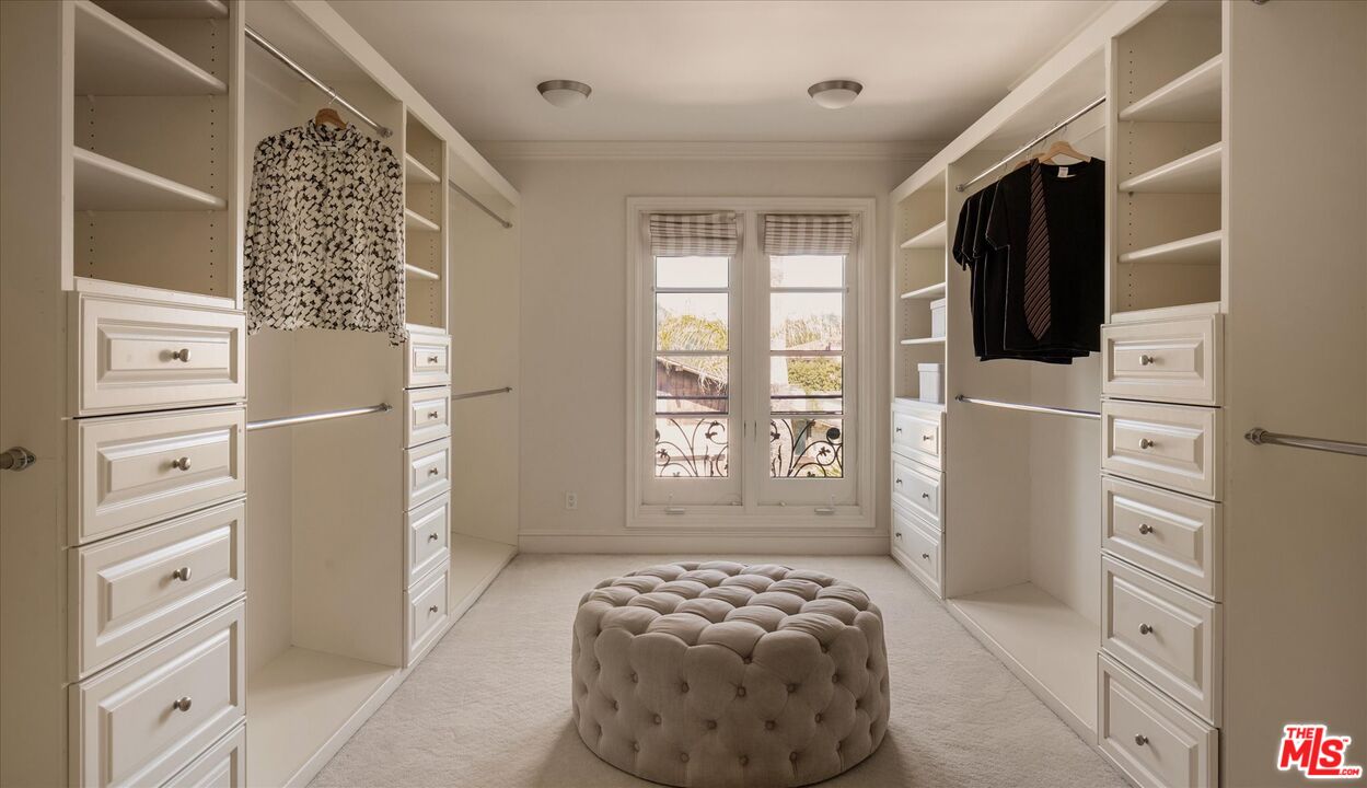 10814 Savona Road Los Angeles, CA 90077 - Photo 19 of 37 a bedroom with a bed and a window