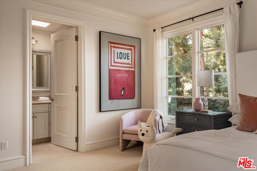 10814 Savona Road Los Angeles, CA 90077 - Photo 23 of 37 a bedroom with a bed and a window