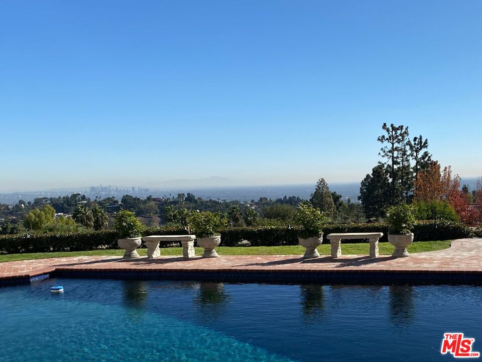 10814 Savona Road Los Angeles, CA 90077 - Photo 28 of 37 a view of swimming pool with a yard