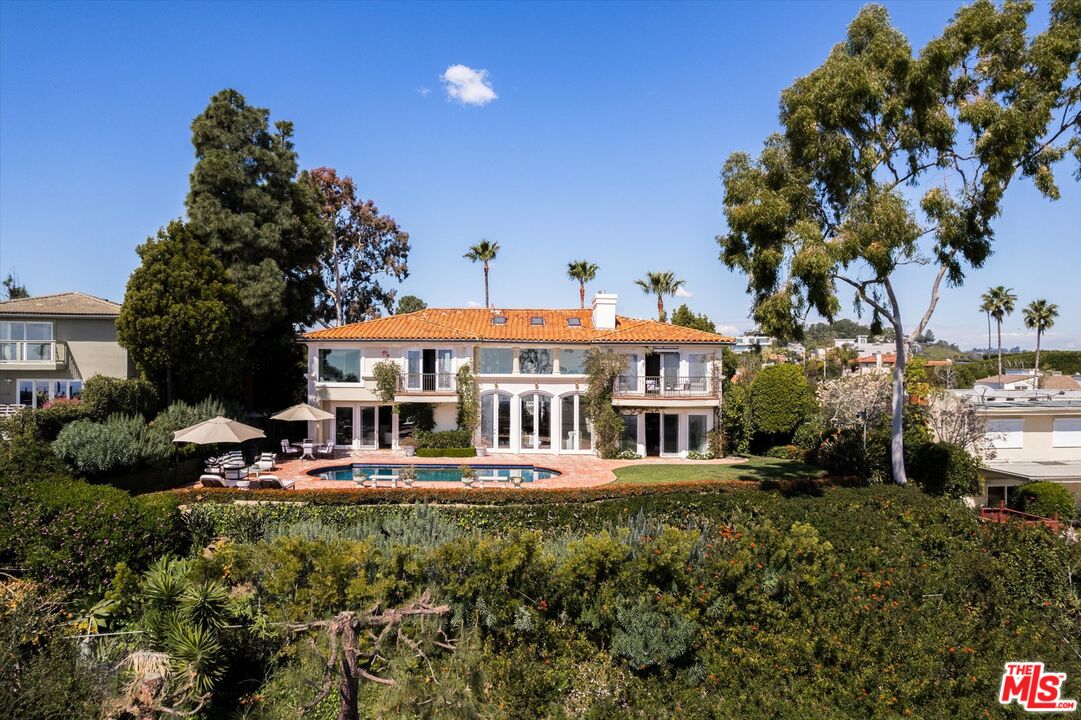 10814 Savona Road Los Angeles, CA 90077 - Photo 30 of 37 a view of a house with a garden and sitting area