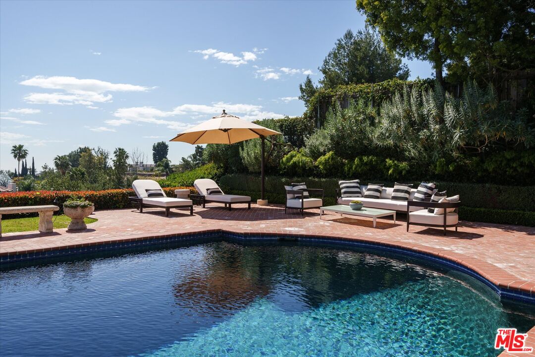 10814 Savona Road Los Angeles, CA 90077 - Photo 32 of 37 a view of swimming pool with chairs and lake view