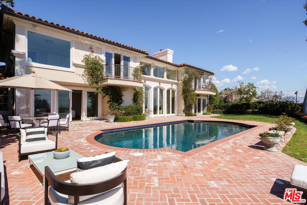 10814 Savona Road Los Angeles, CA 90077 - Photo 33 of 37 a view of a house with swimming pool and sitting area