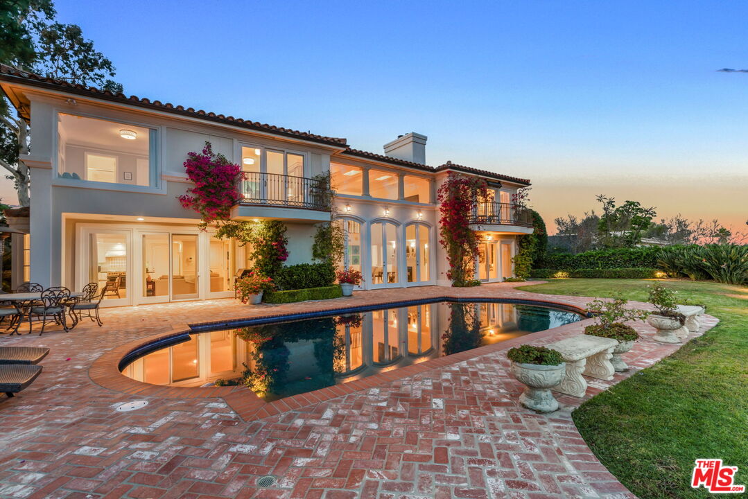 10814 Savona Road Los Angeles, CA 90077 - Photo 34 of 37 a view of a house with swimming pool and sitting area