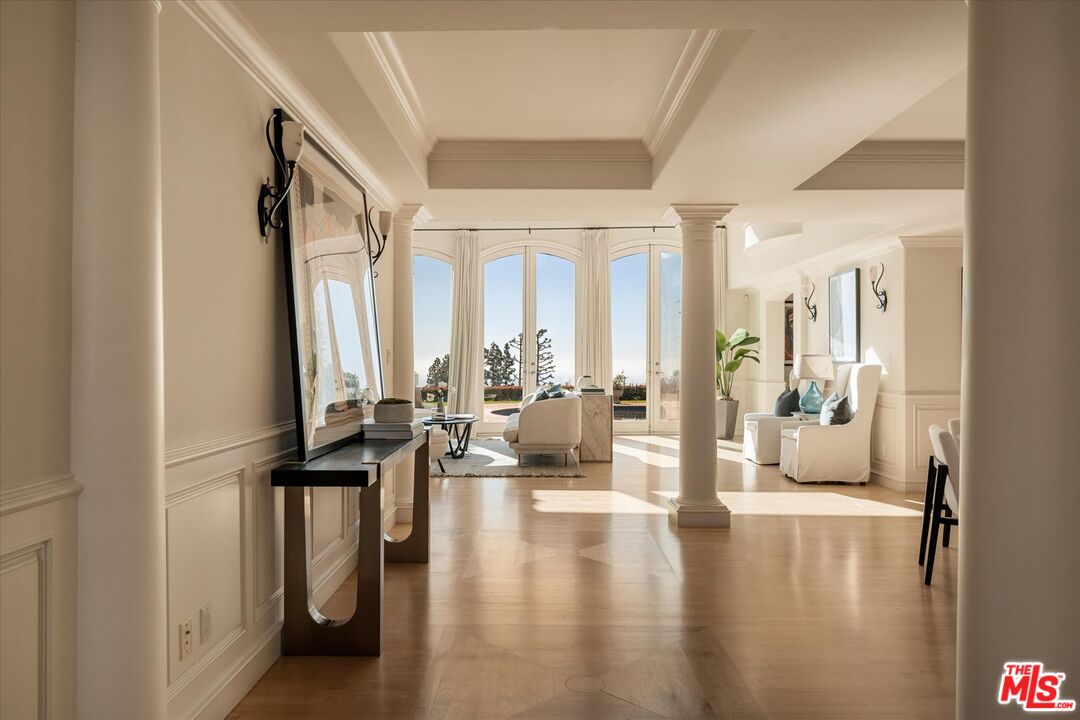 10814 Savona Road Los Angeles, CA 90077 - Photo 5 of 37 a living room with furniture and large windows