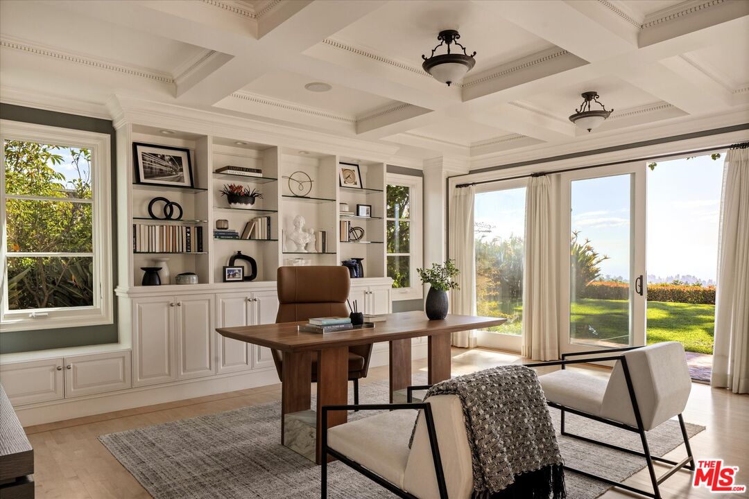10814 Savona Road Los Angeles, CA 90077 - Photo 7 of 37 a view of a workspace with furniture and a window