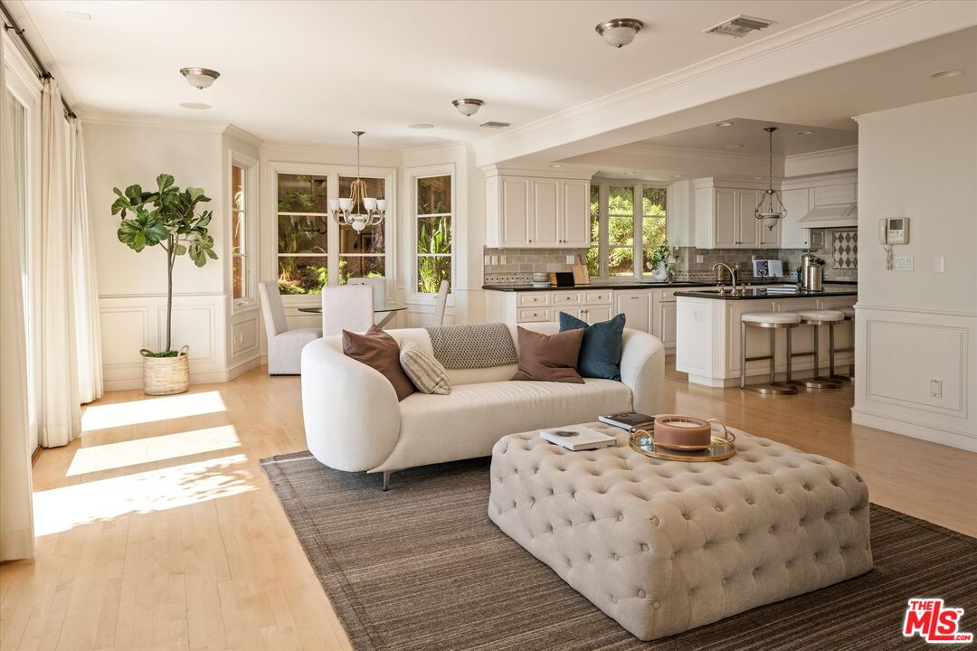 10814 Savona Road Los Angeles, CA 90077 - Photo 8 of 37 a living room with furniture and a large window