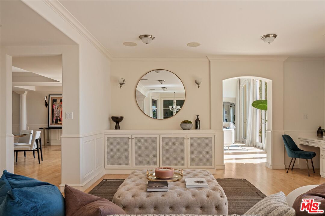 10814 Savona Road Los Angeles, CA 90077 - Photo 9 of 37 a living room with furniture and a large window