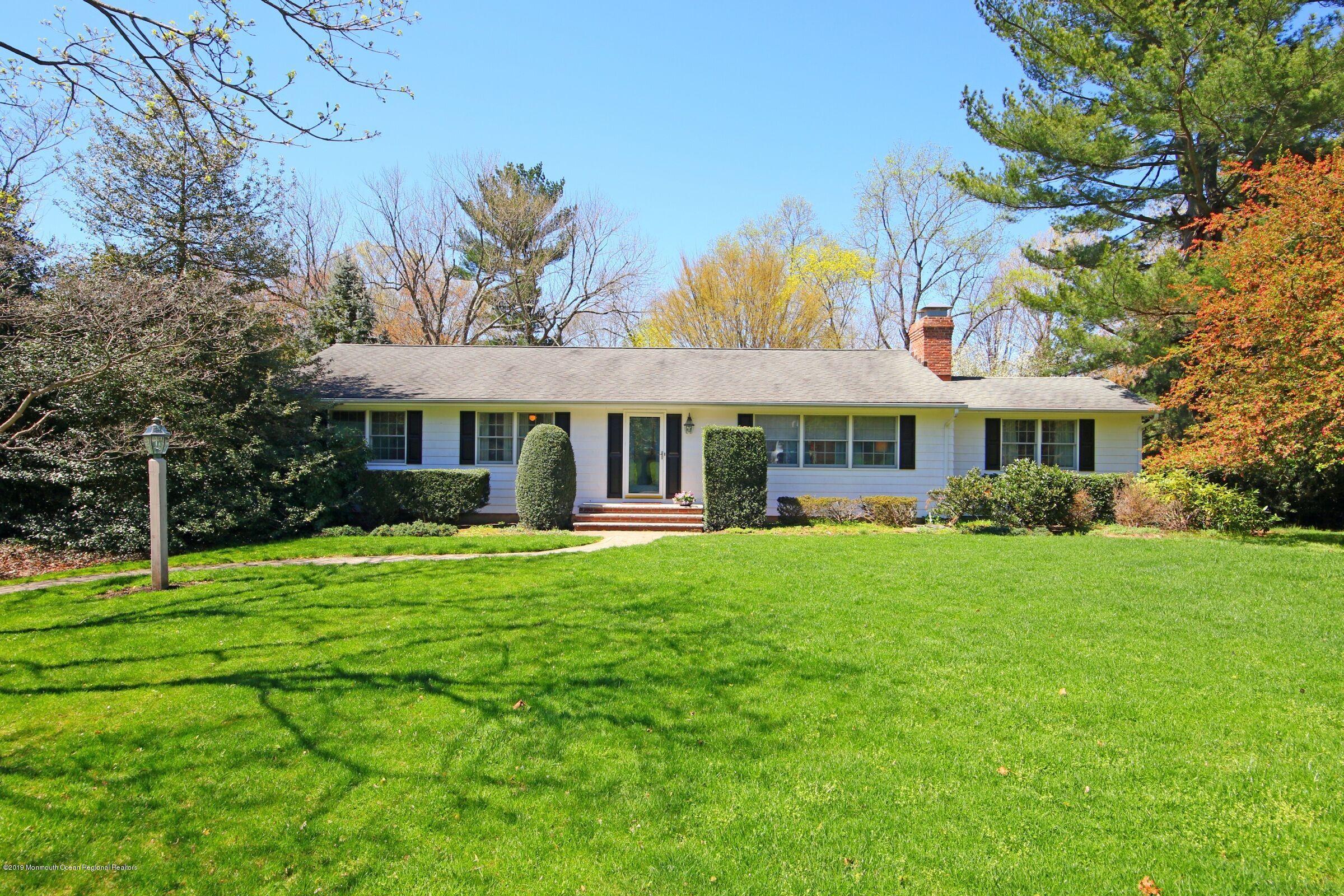 81 Mallard Road Middletown, NJ 07748 - Photo 1 of 25 a front view of a house with a garden