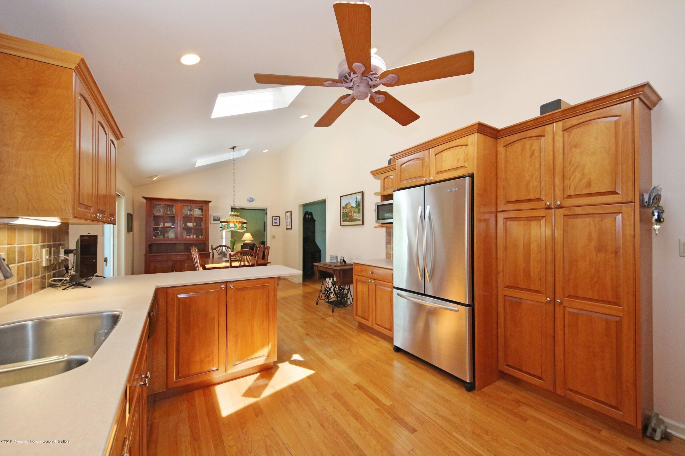 81 Mallard Road Middletown, NJ 07748 - Photo 12 of 25 a living room with stainless steel appliances furniture and a kitchen view