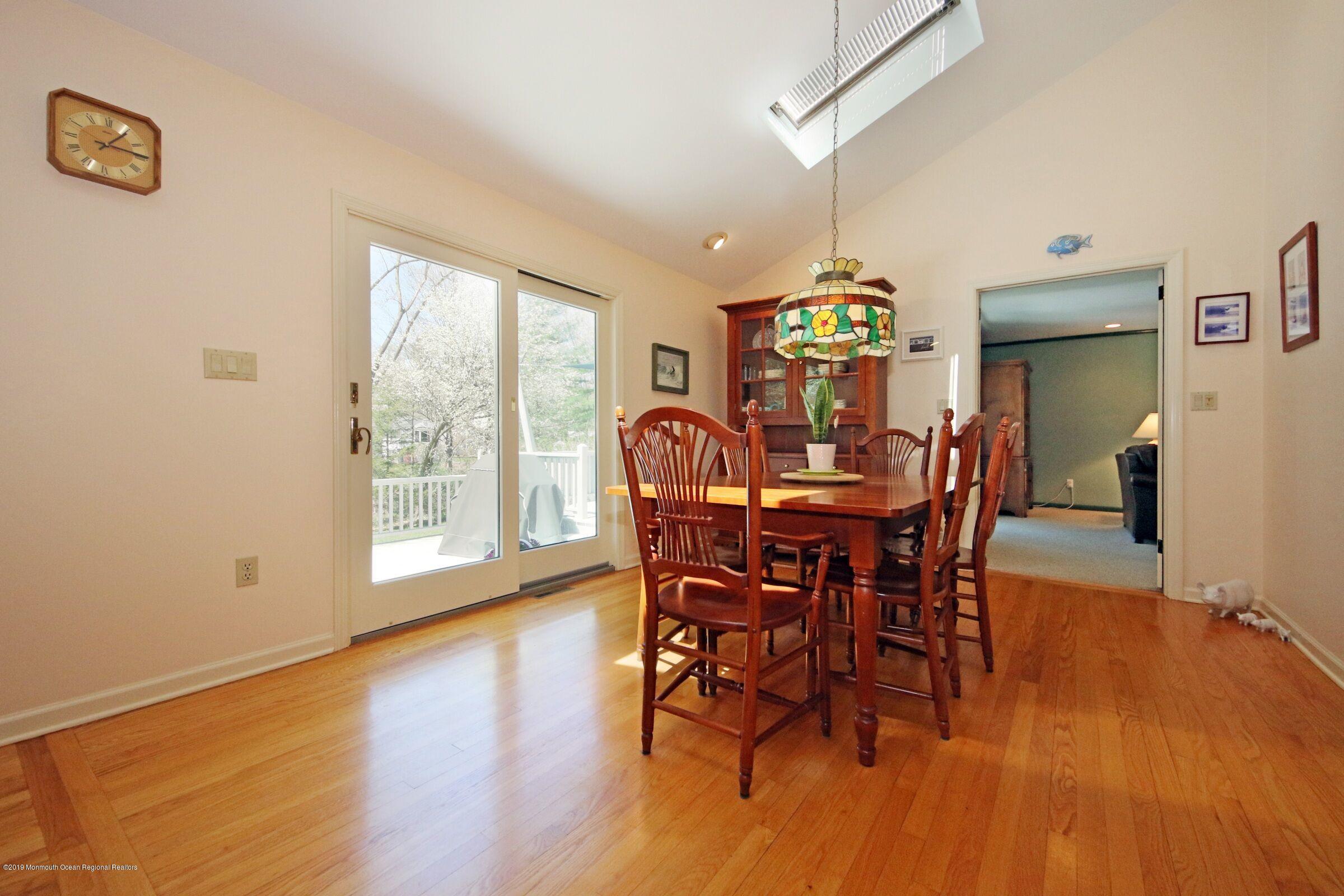 81 Mallard Road Middletown, NJ 07748 - Photo 14 of 25 a dining room with furniture and chandelier