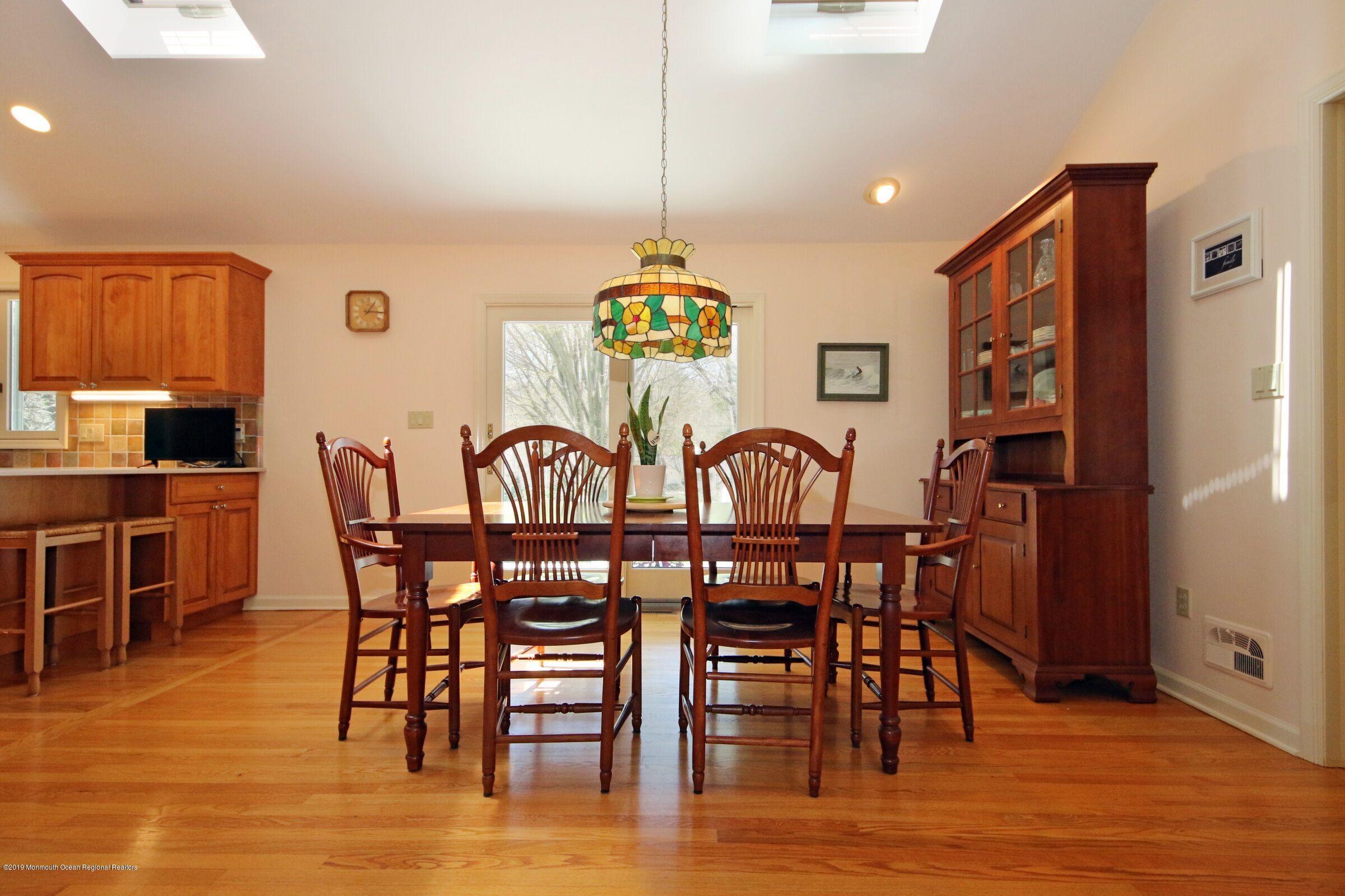 81 Mallard Road Middletown, NJ 07748 - Photo 15 of 25 a view of a dining room with furniture window and wooden floor