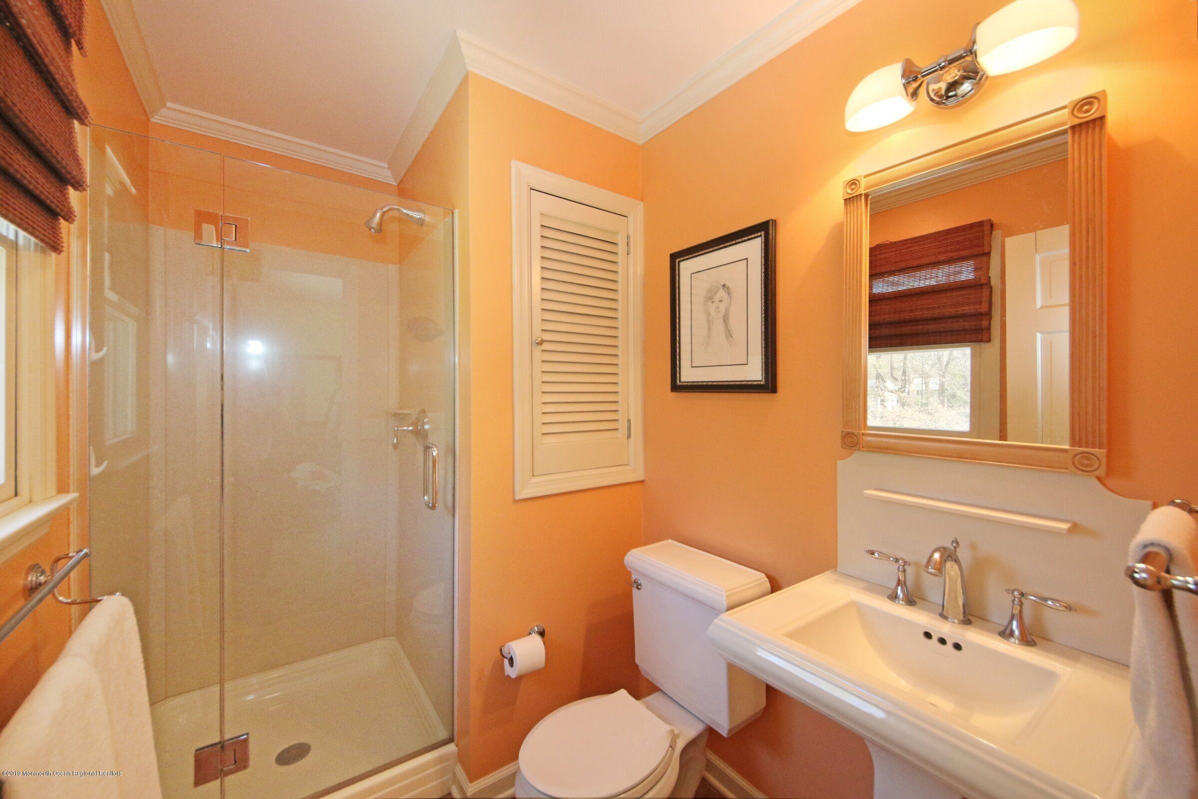 81 Mallard Road Middletown, NJ 07748 - Photo 19 of 25 a bathroom with a sink toilet and shower