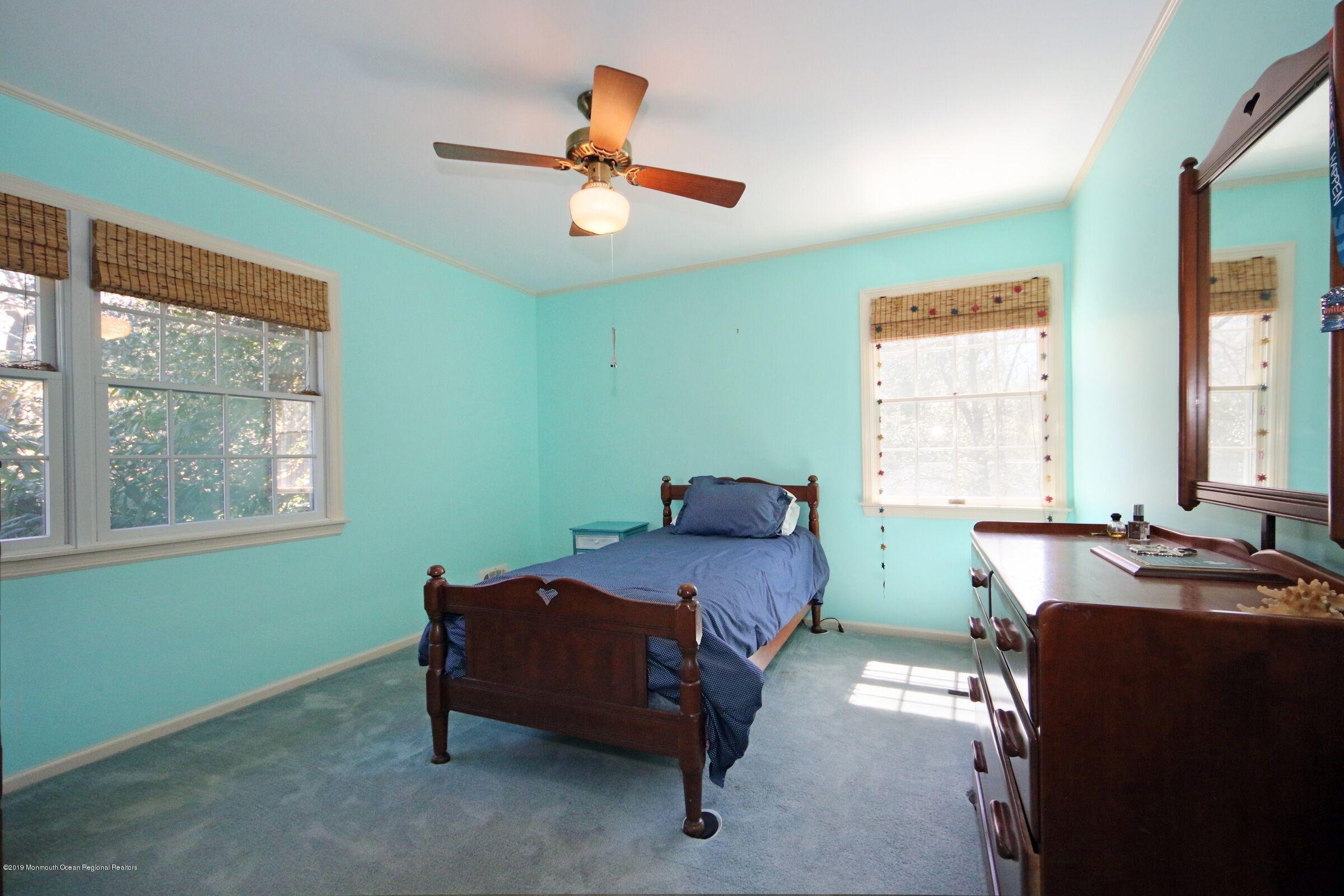 81 Mallard Road Middletown, NJ 07748 - Photo 20 of 25 a bedroom with a bed and a window