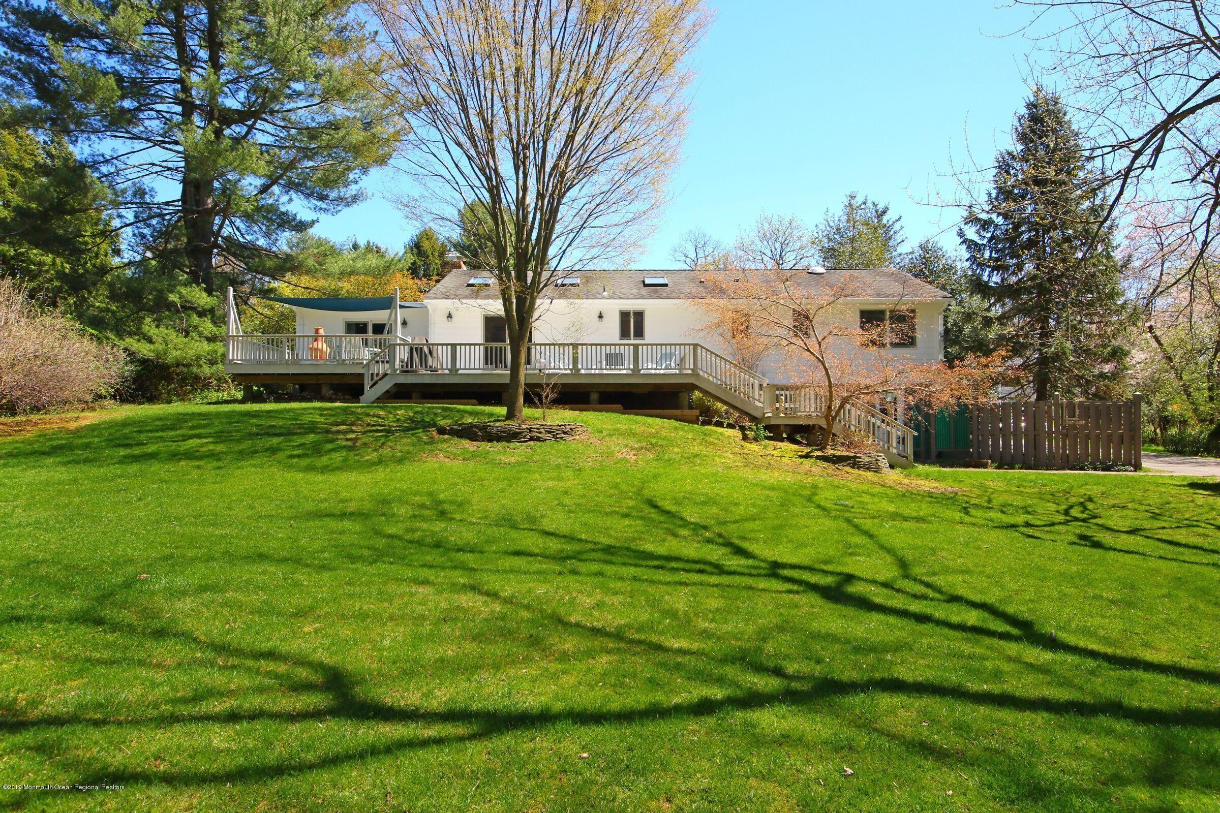 81 Mallard Road Middletown, NJ 07748 - Photo 3 of 25 a view of a yard in front of house