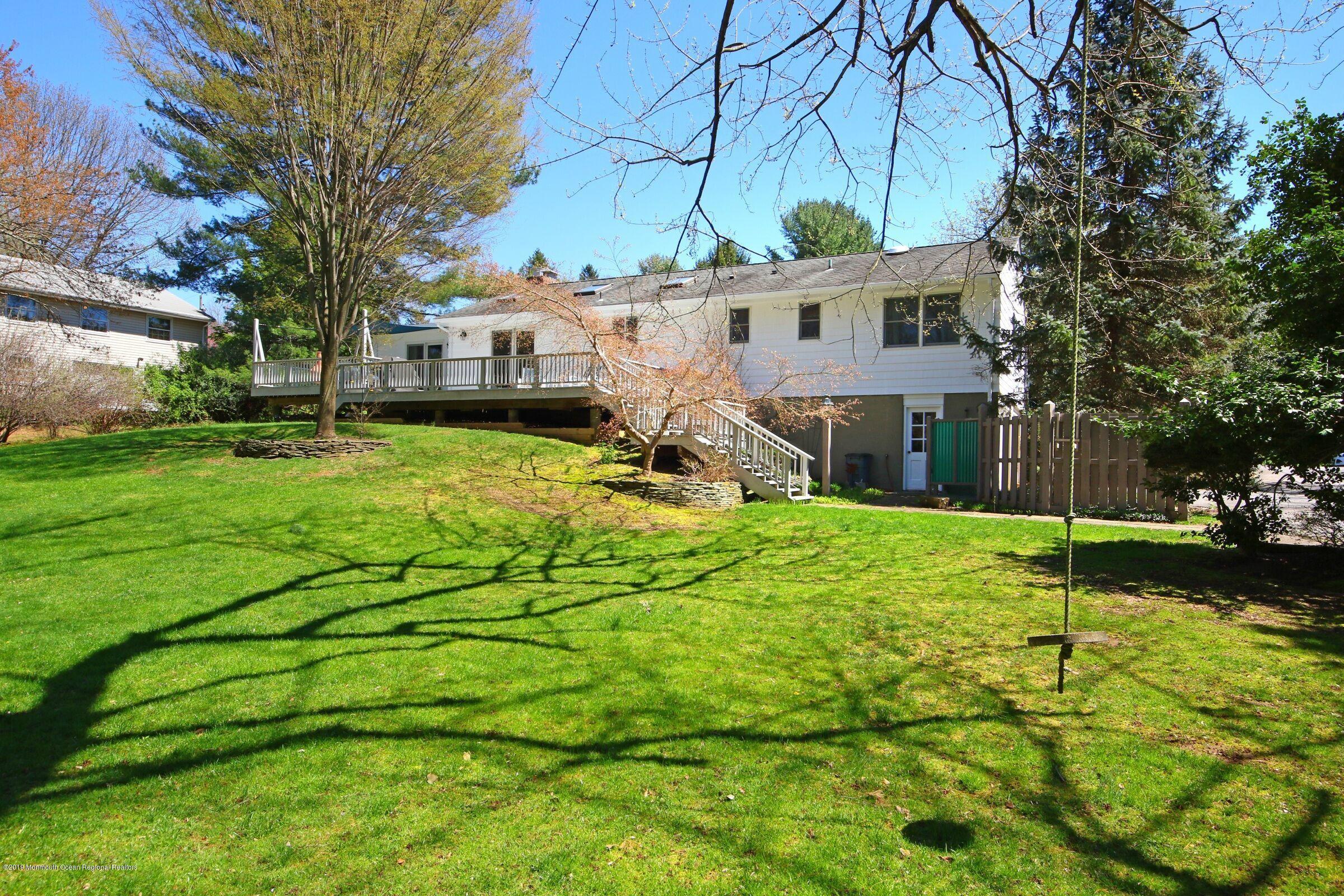 81 Mallard Road Middletown, NJ 07748 - Photo 5 of 25 a view of a house with a yard