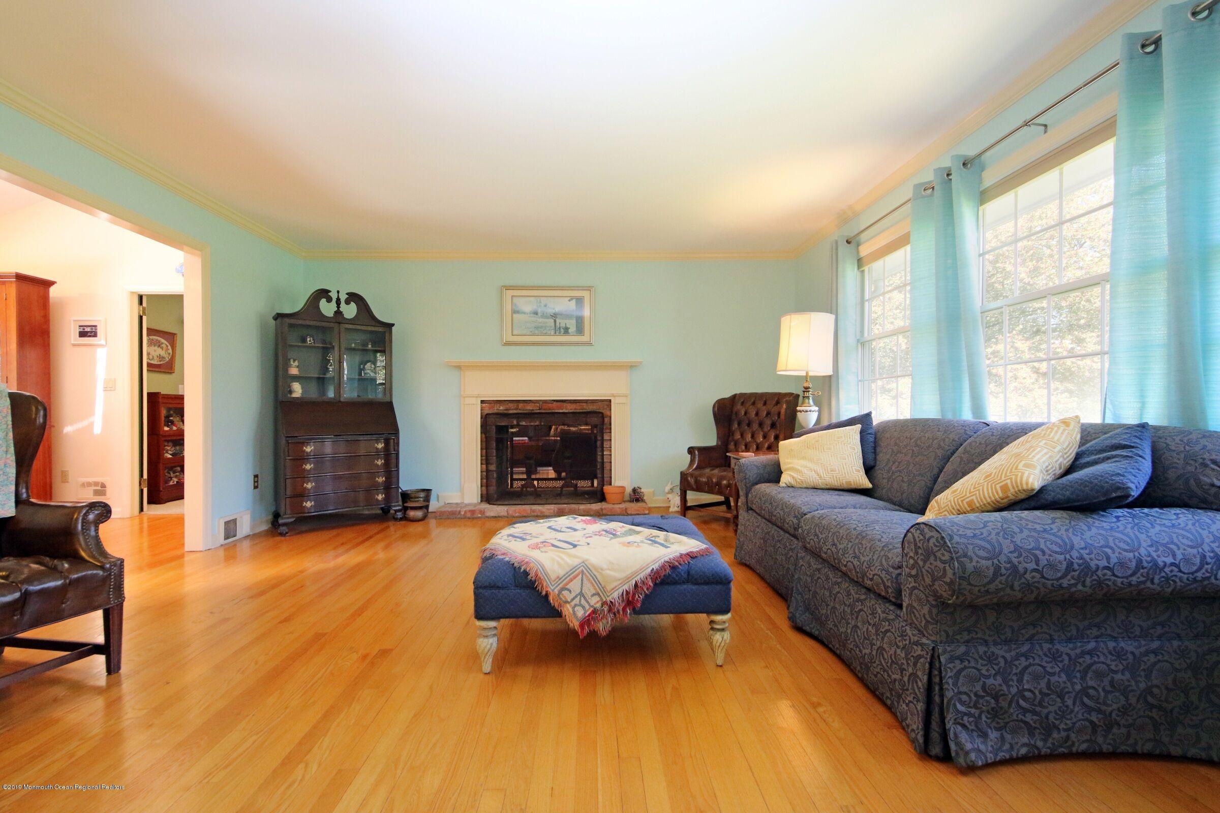 81 Mallard Road Middletown, NJ 07748 - Photo 8 of 25 a living room with furniture and a fireplace