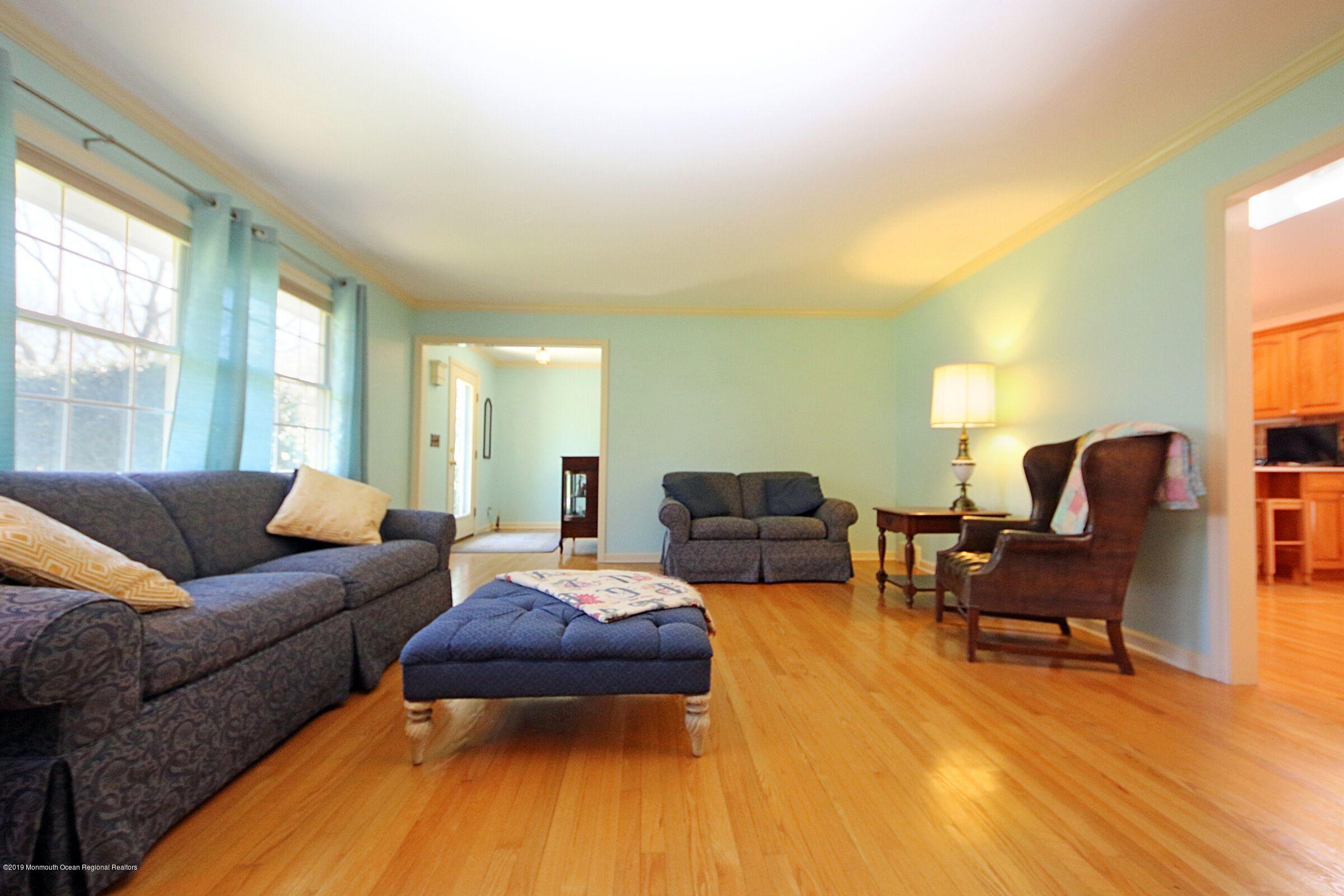 81 Mallard Road Middletown, NJ 07748 - Photo 9 of 25 a living room with furniture and a wooden floor