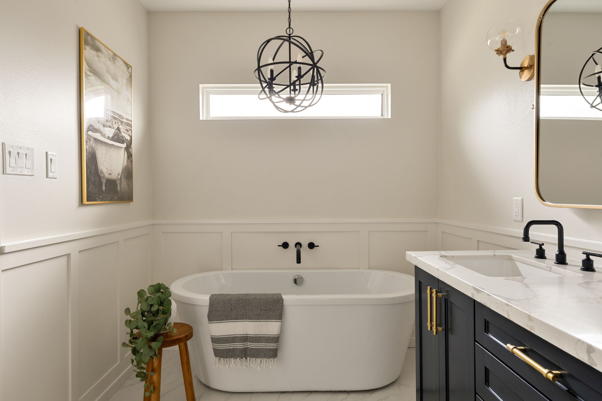 1022 Key Street Houston, TX 77009 - Photo 18 of 30 Unwind in the deep soaking tub, perfectly positioned beneath a dazzling chandelier.