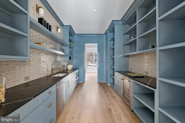 a kitchen with granite countertop stainless steel appliances and wooden cabinets