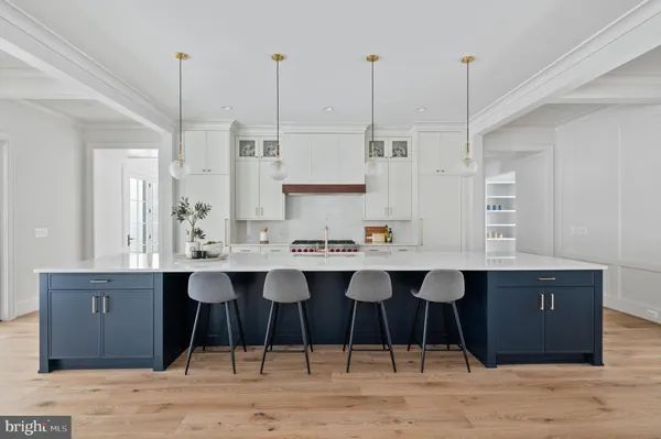 a kitchen with a sink and center island