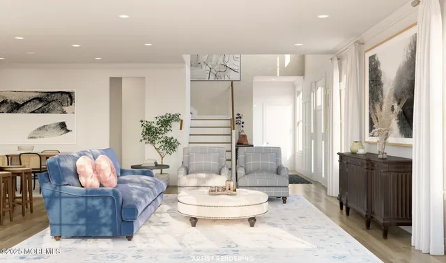 a living room with furniture and a wooden floor